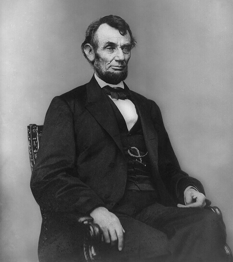 800px-Abraham_Lincoln_seated,_Feb_9,_1864